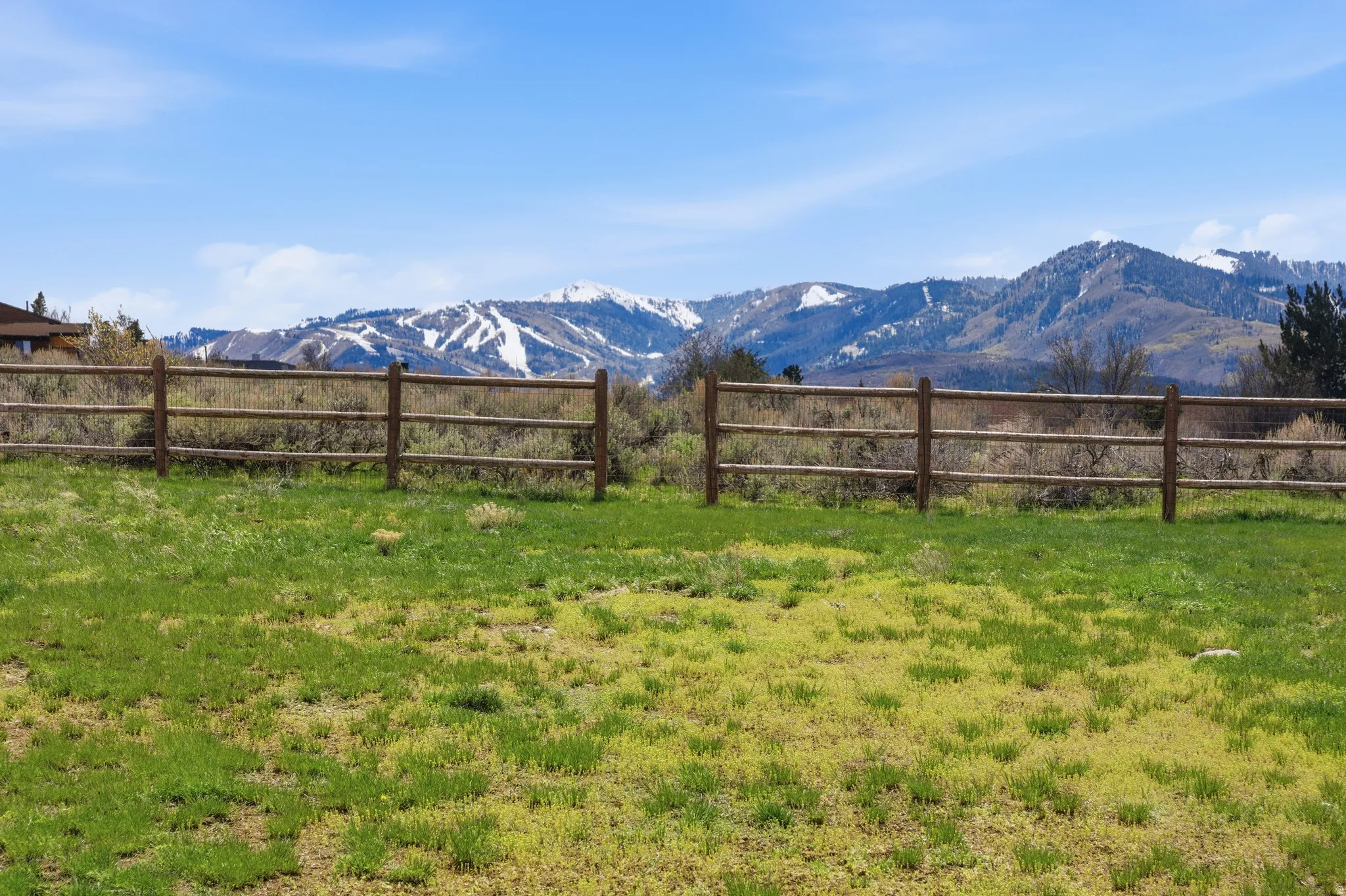 Grassy expanse with split-rail fencing