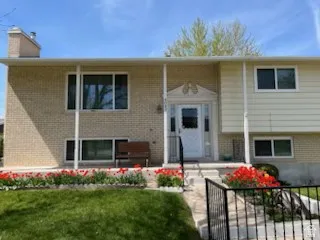 Classic brick and siding exterior with a welcoming covered front porch