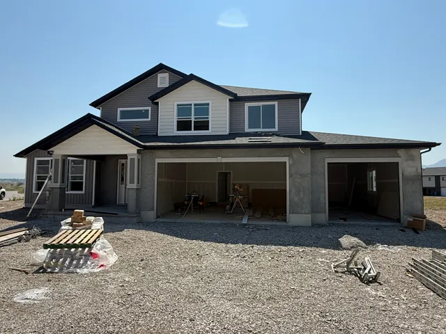 Two-story exterior with multi-toned siding and dark trim