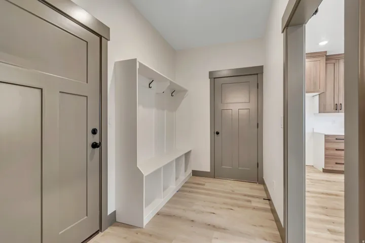 Mudroom featuring light wood-type flooring and recessed lighting
