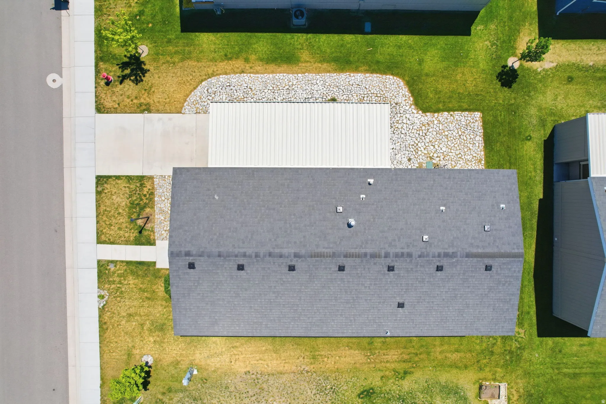 Asphalt shingle roofing over a rectangular structure