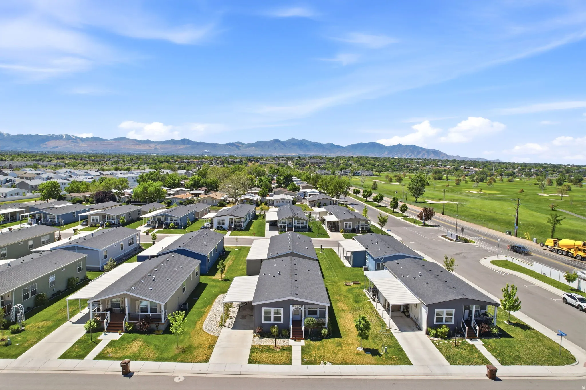 Aerial perspective showcasing a residential community with uniform home designs