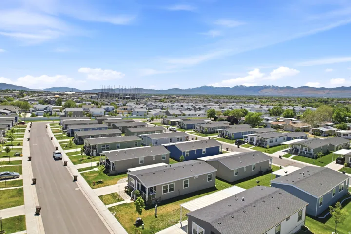 Residential community featuring individual manufactured homes with varying exterior colors