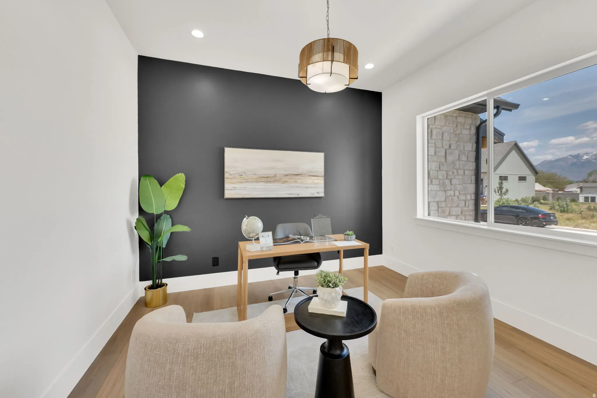 Interior space featuring wood-finish flooring, a contemporary chandelier, and recessed lighting