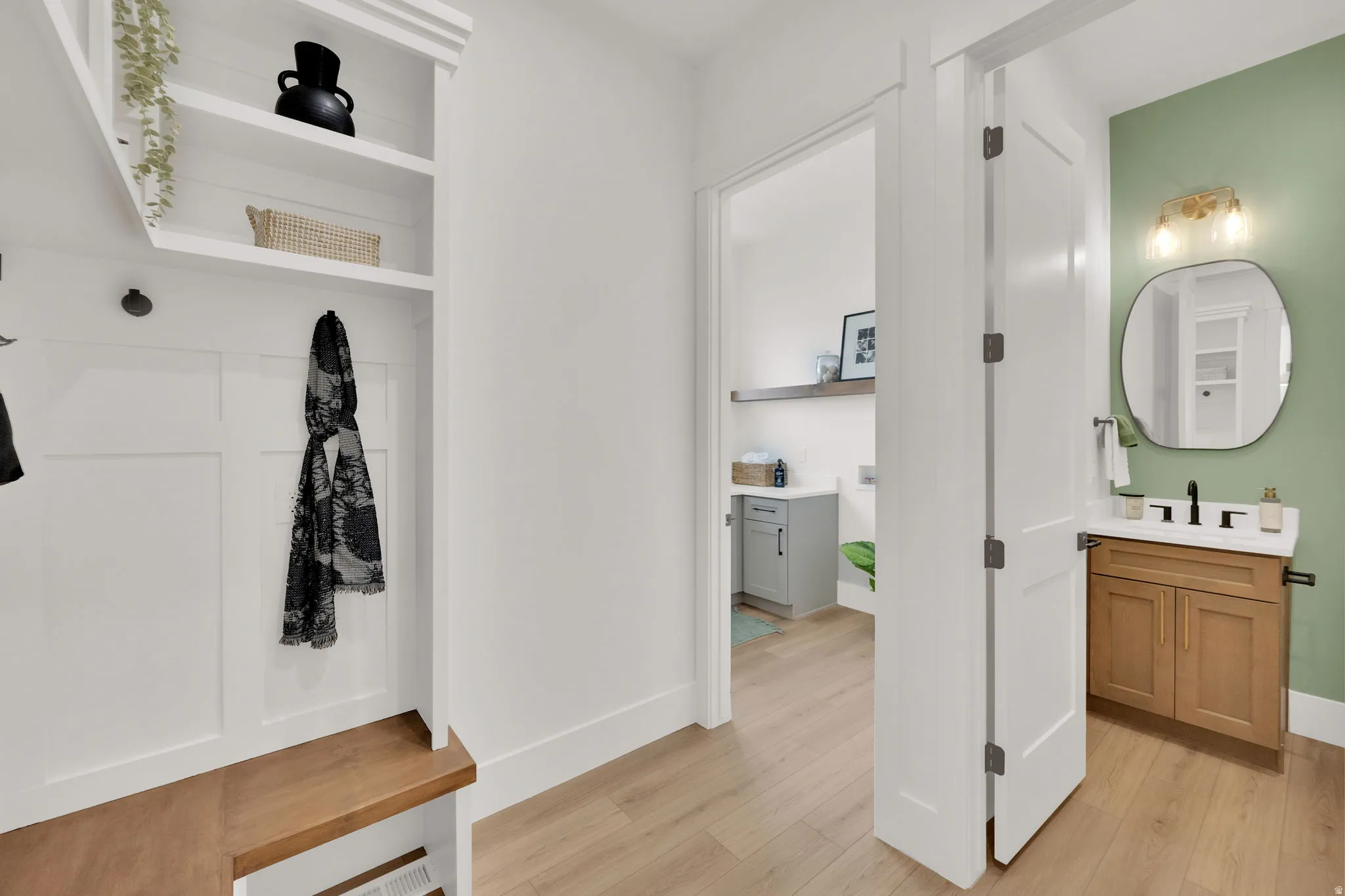 Entryway mudroom bench with natural wood-finish top and integrated storage