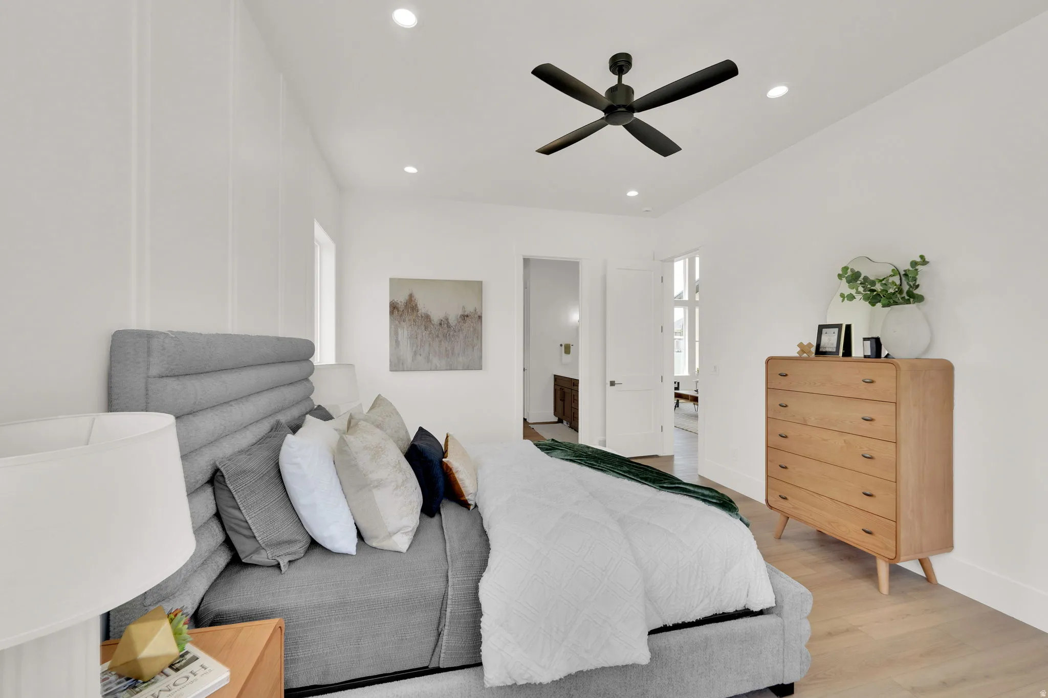 White-painted walls with vertical paneling and recessed lighting