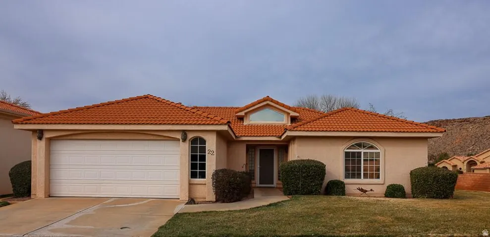 Stucco exterior with a terracotta tile roof