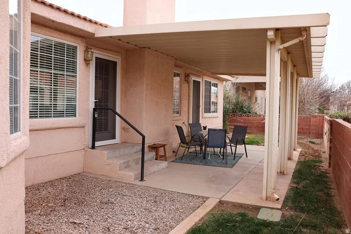 Covered patio featuring concrete flooring and stucco exterior