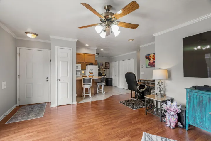 Open concept living area featuring laminate flooring