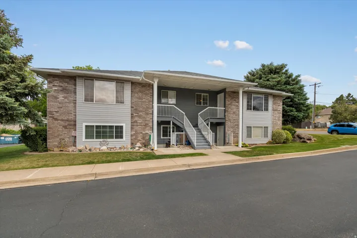 Two-story multi-unit structure featuring brick and siding exterior