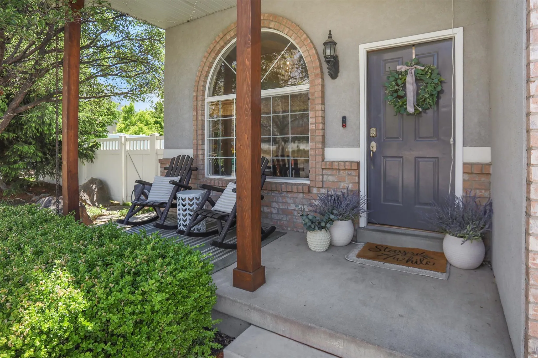 Covered porch entry featuring wood support columns