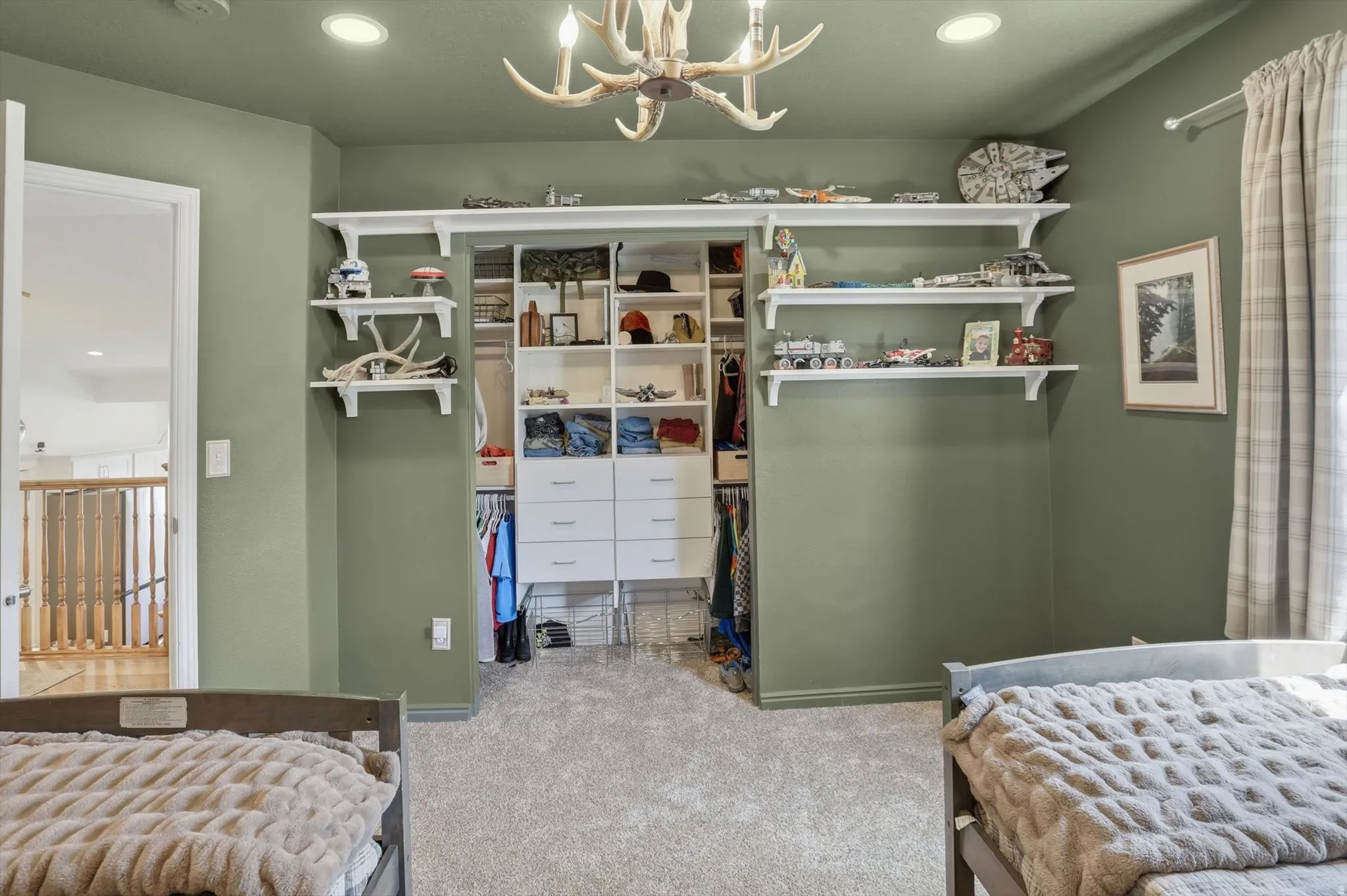 Integrated closet system featuring white shelving and drawers