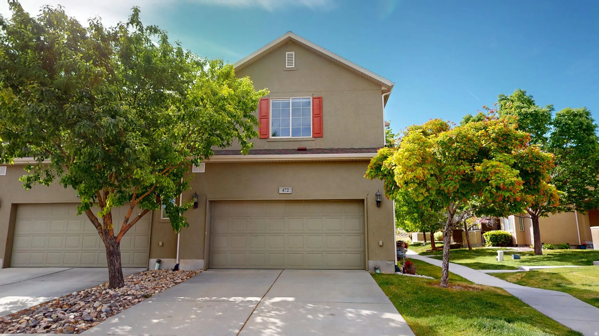 Two-story stucco property with attached garage
