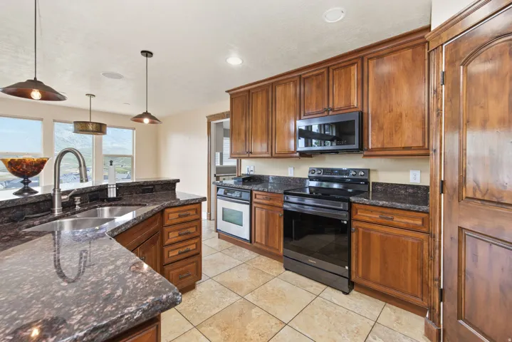 Alder Cabinets & Gorgeous Granite Counters