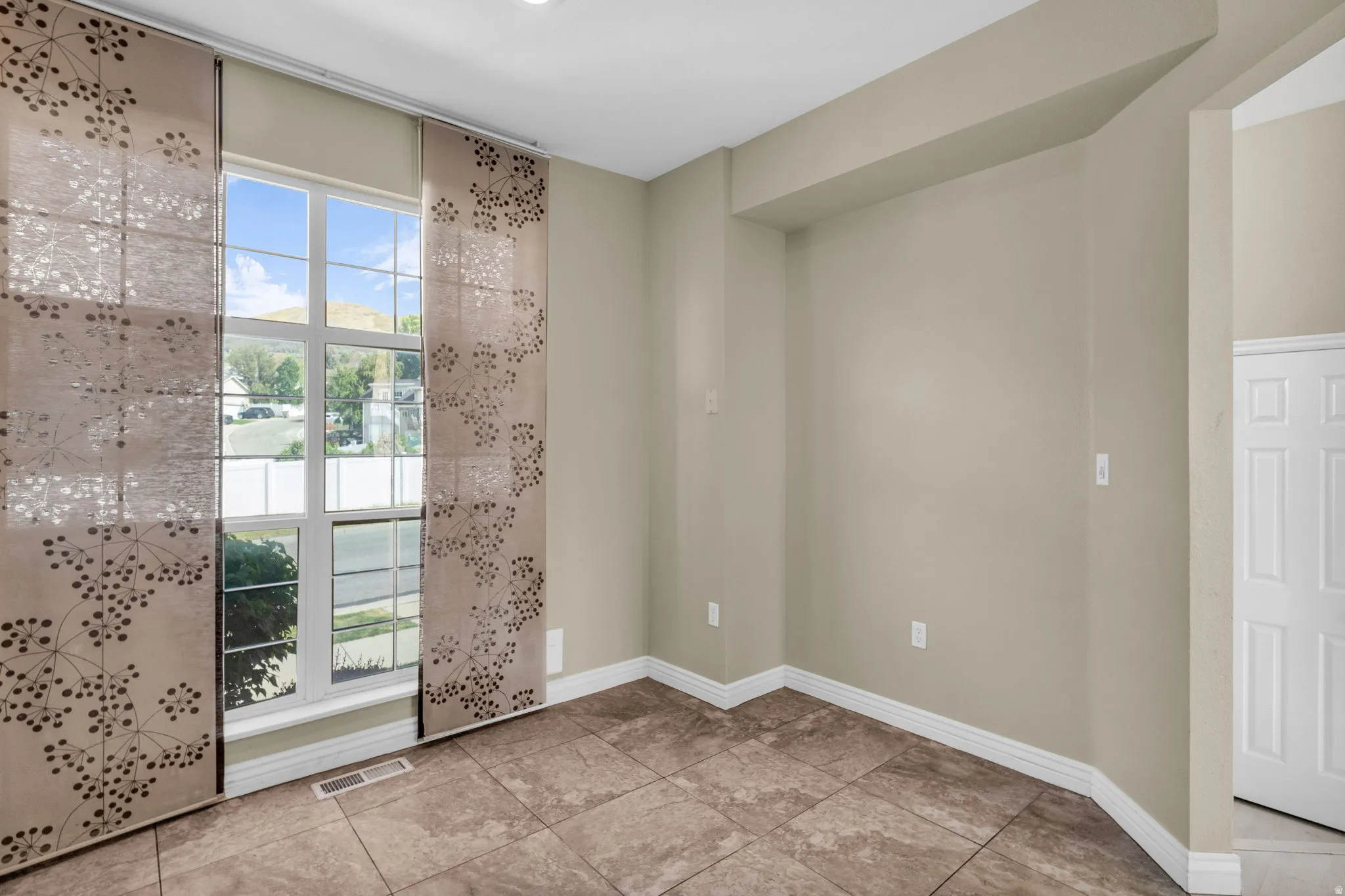 Recessed lighting illuminates neutral-toned walls