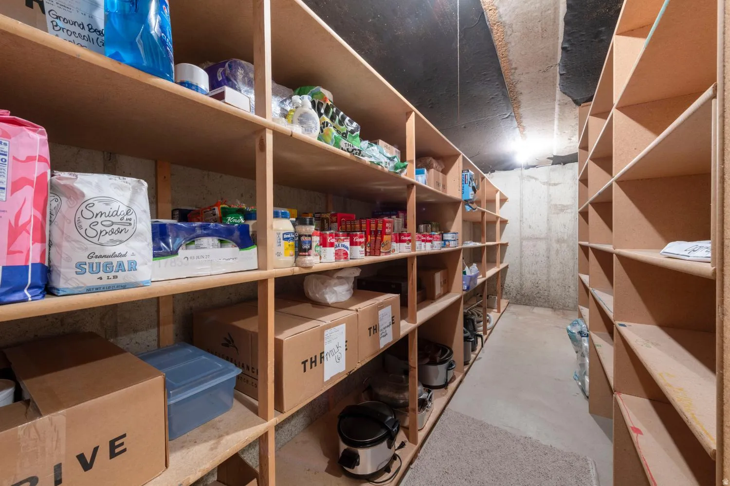 Extensive built-in wood shelving providing abundant storage