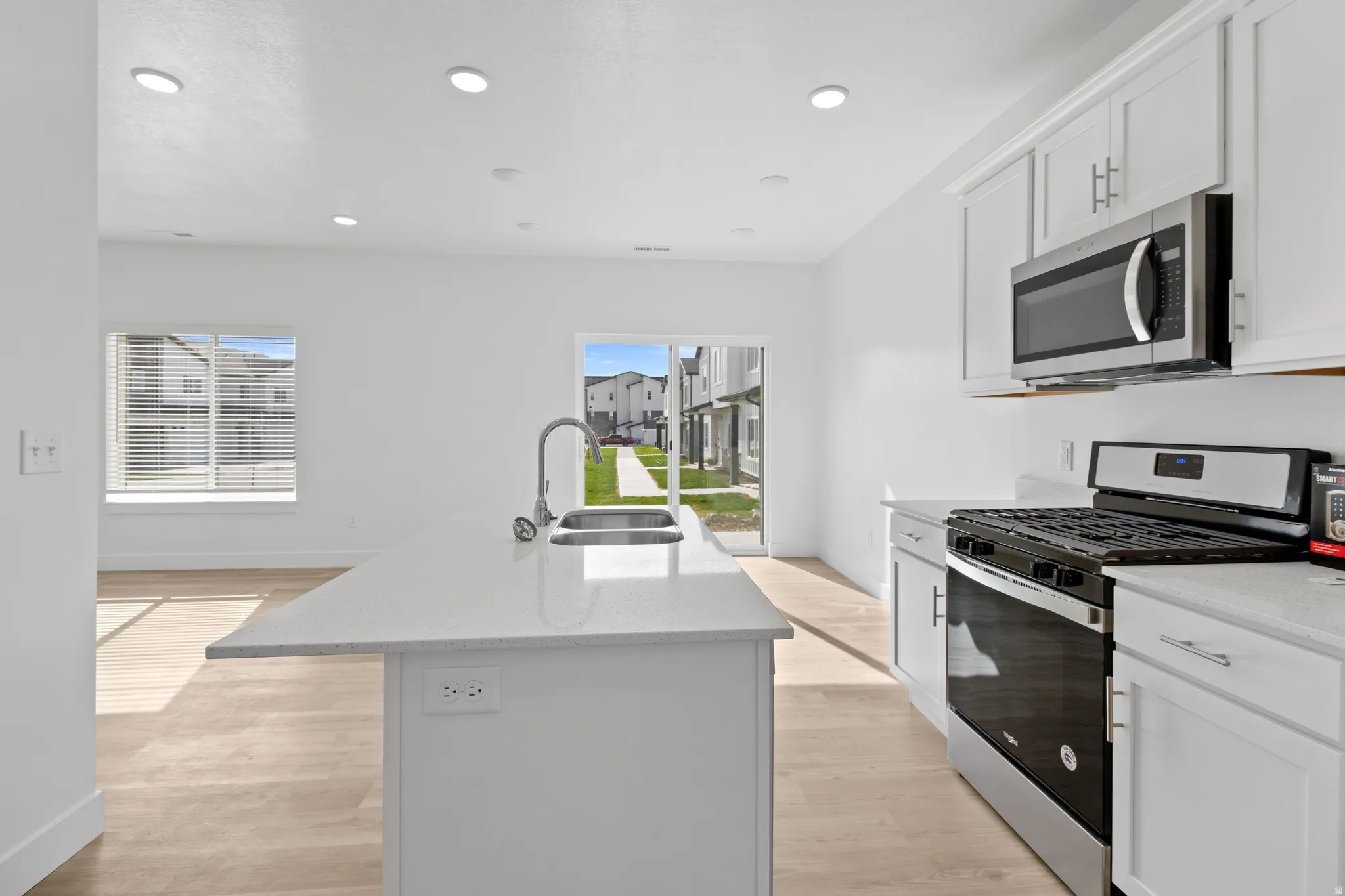 Modern kitchen island with an undermount sink and gooseneck faucet