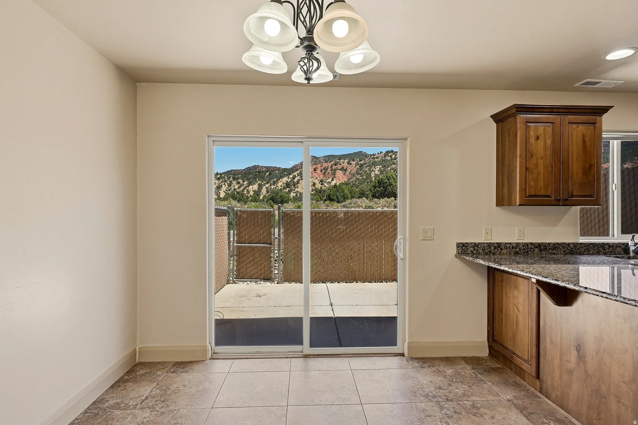 Patio access from the interior space, featuring a sliding glass door
