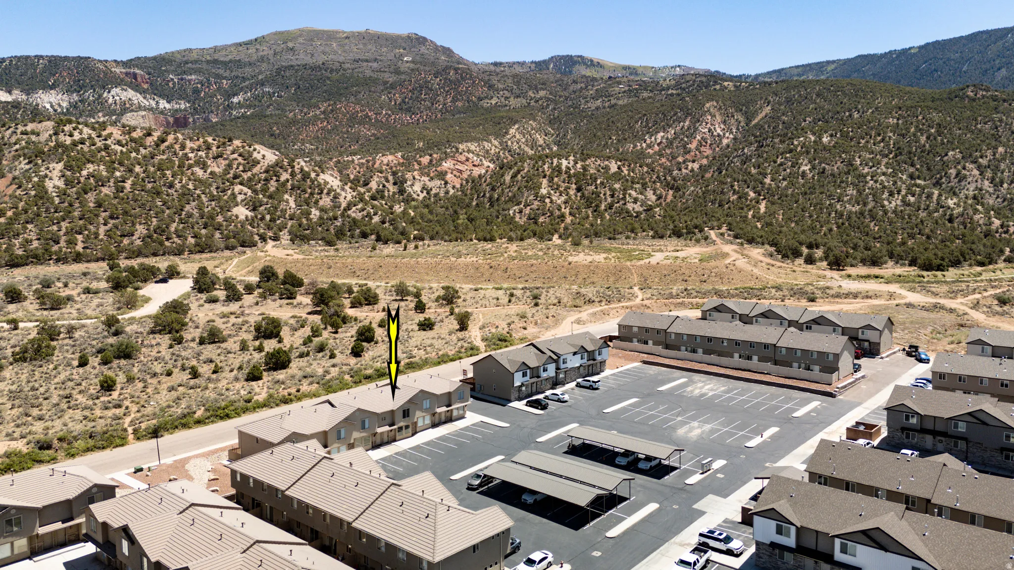 Townhome community featuring multi-story units with mountain scenery