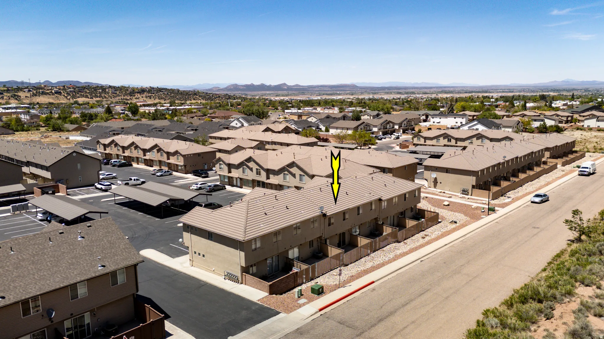 Multi-story residential buildings featuring stucco exteriors and tiled roofs