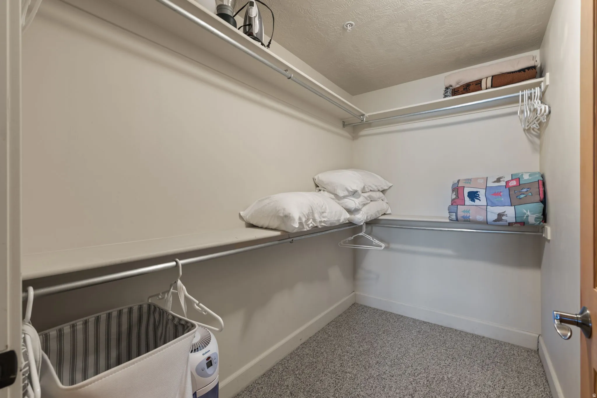 Walk-in closet in primary suite