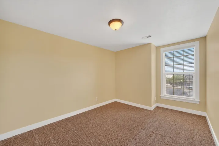 Neutral-toned wall finishes with white trim accents