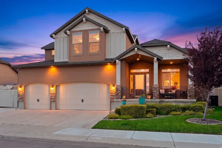 Contemporary stucco and siding exterior with stone accents