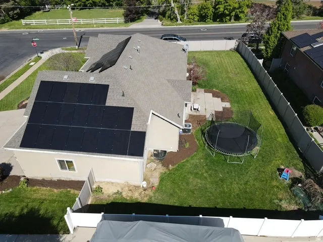 Contemporary residence featuring a pitched roof with extensive solar paneling
