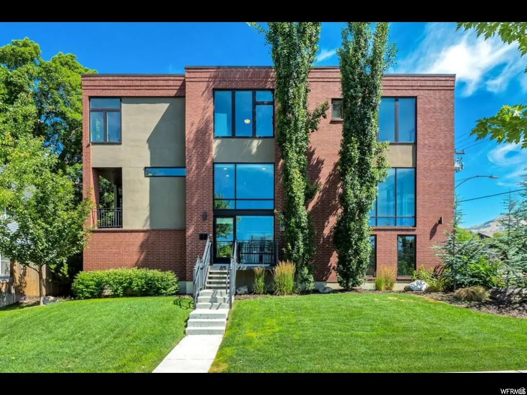 Contemporary architectural design featuring a brick and stucco facade