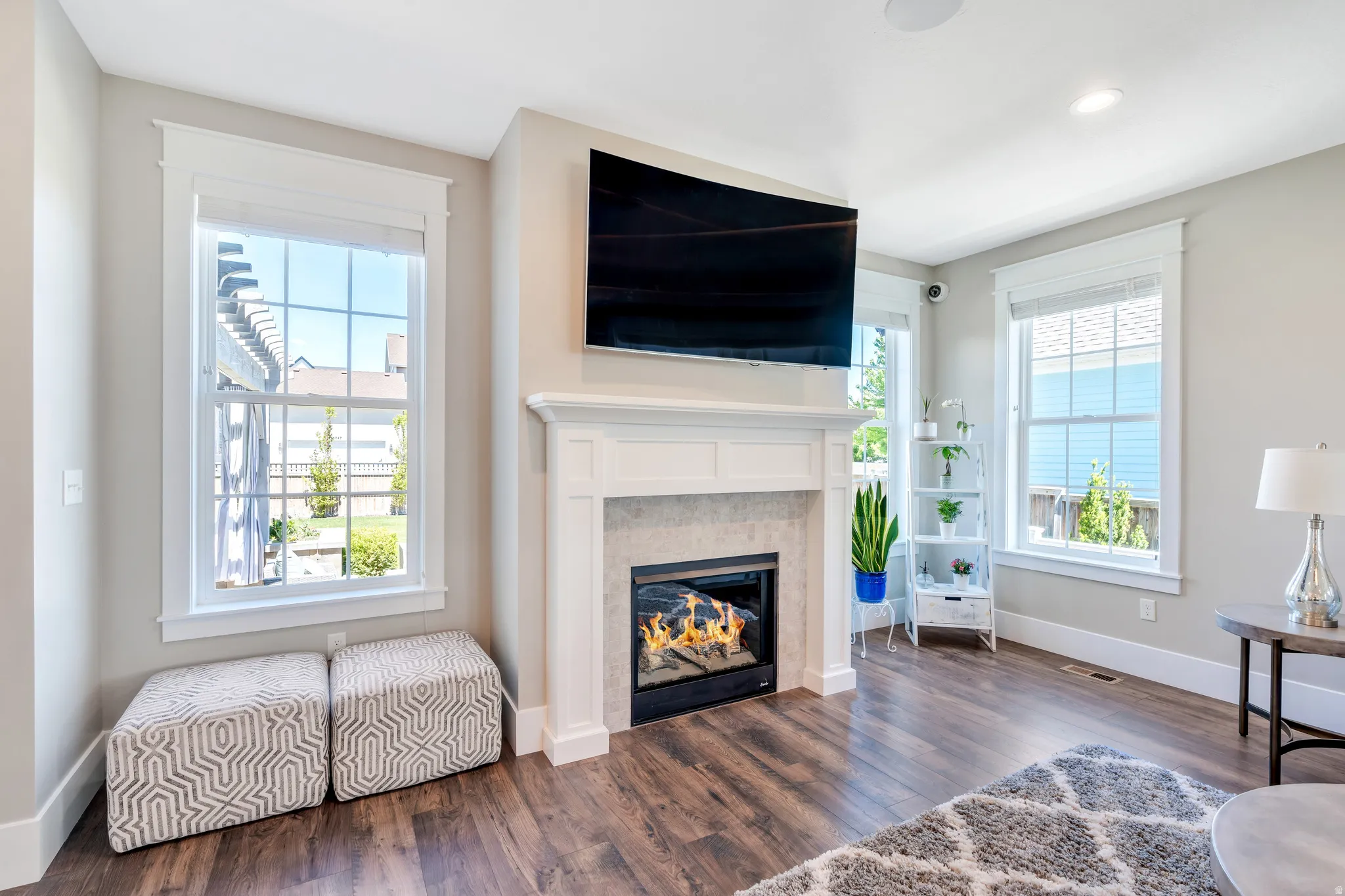 Gorgeous fireplace with gorgeous windows to open up and brighten the space