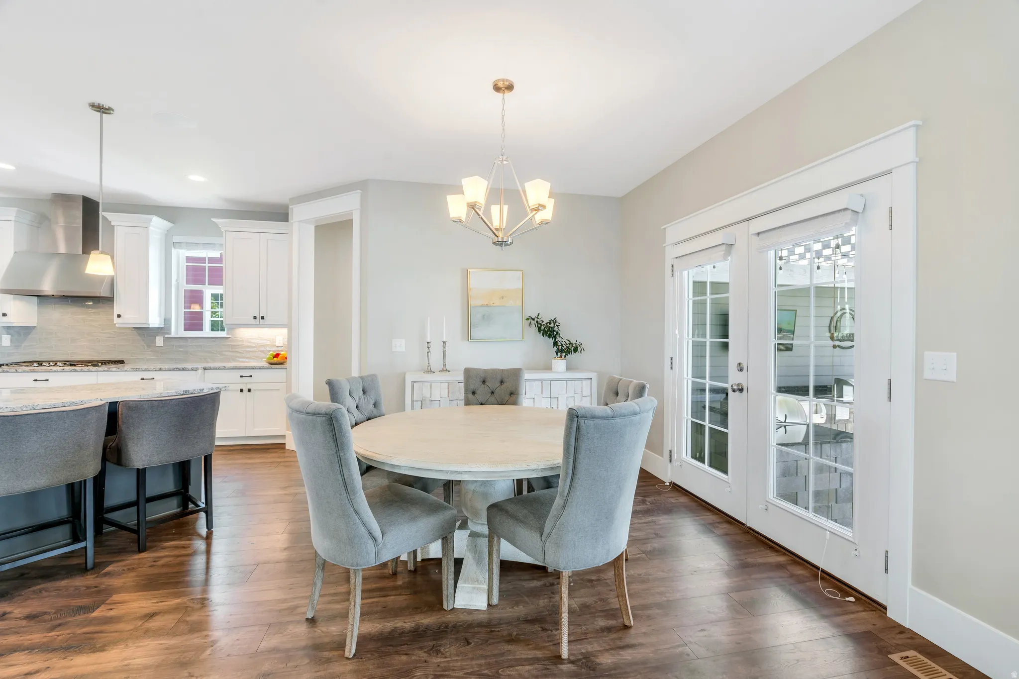 Stunning light filled dining room featuring access to the backyard kitchen and patio