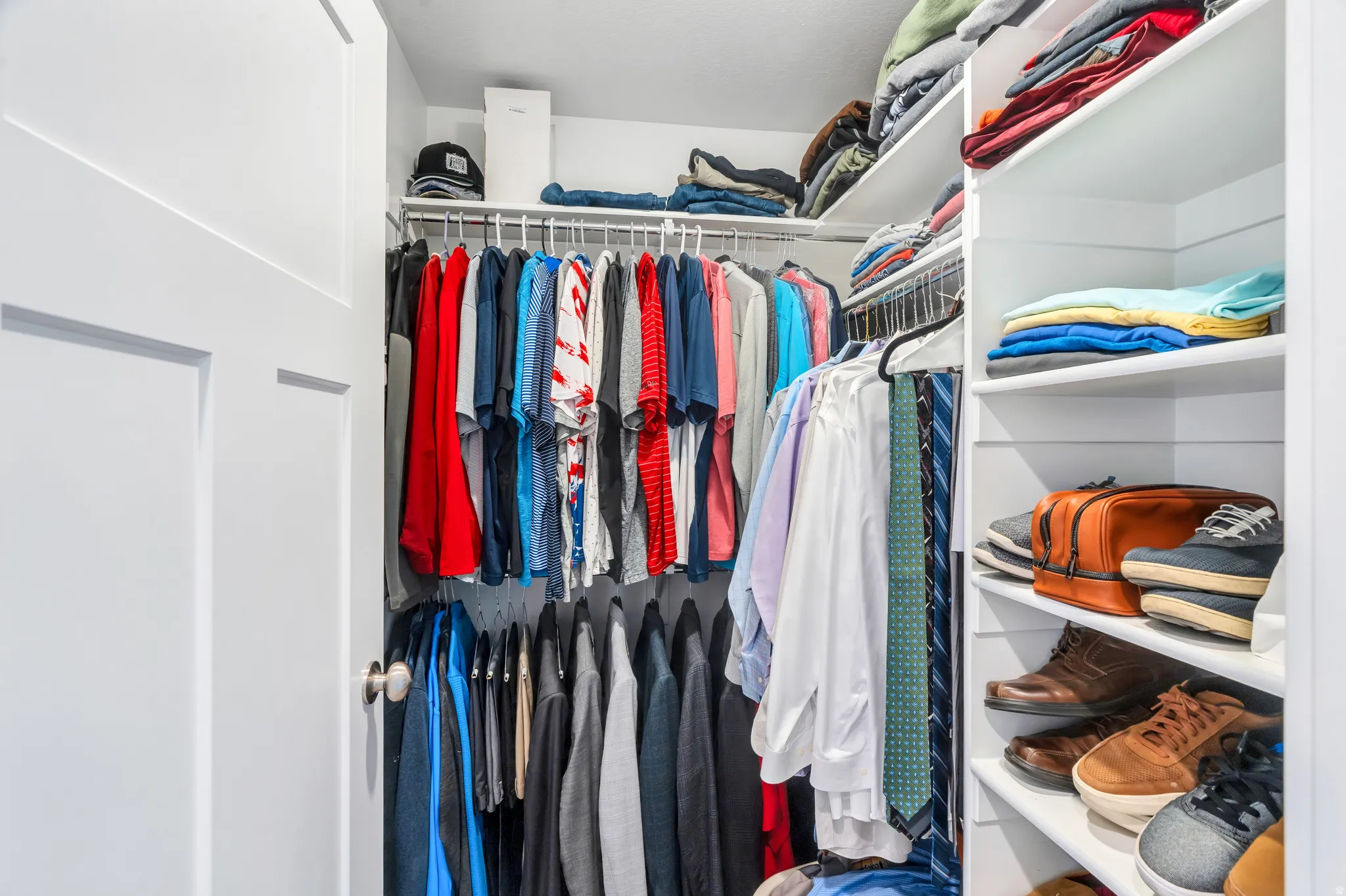 Showcasing ample hanging racks, and storage shelves