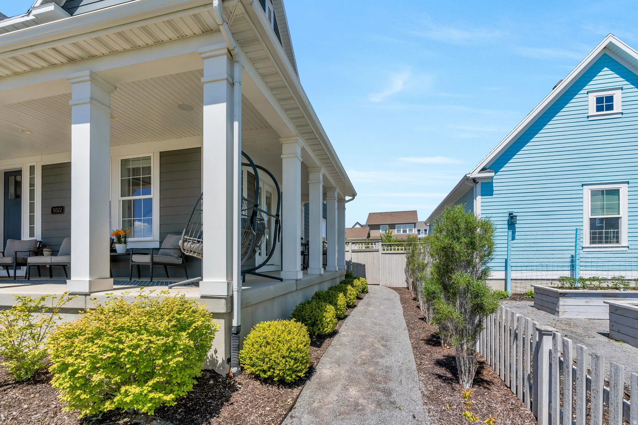Featuring the homes paved walking path to the backyard and downstairs private entrance
