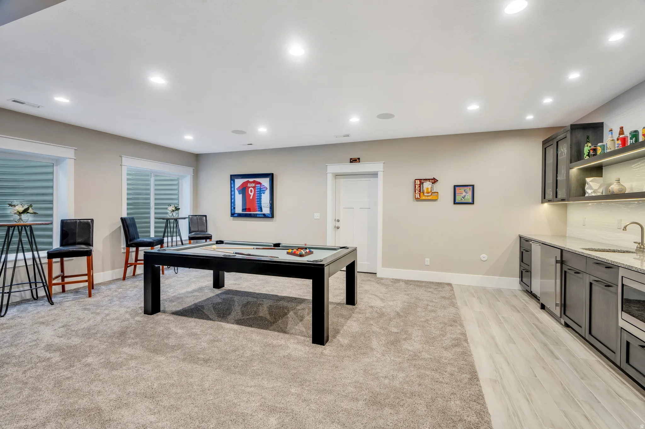 Perfect space for entertainment such as games, featuring a full kitchenette, and private entrance access