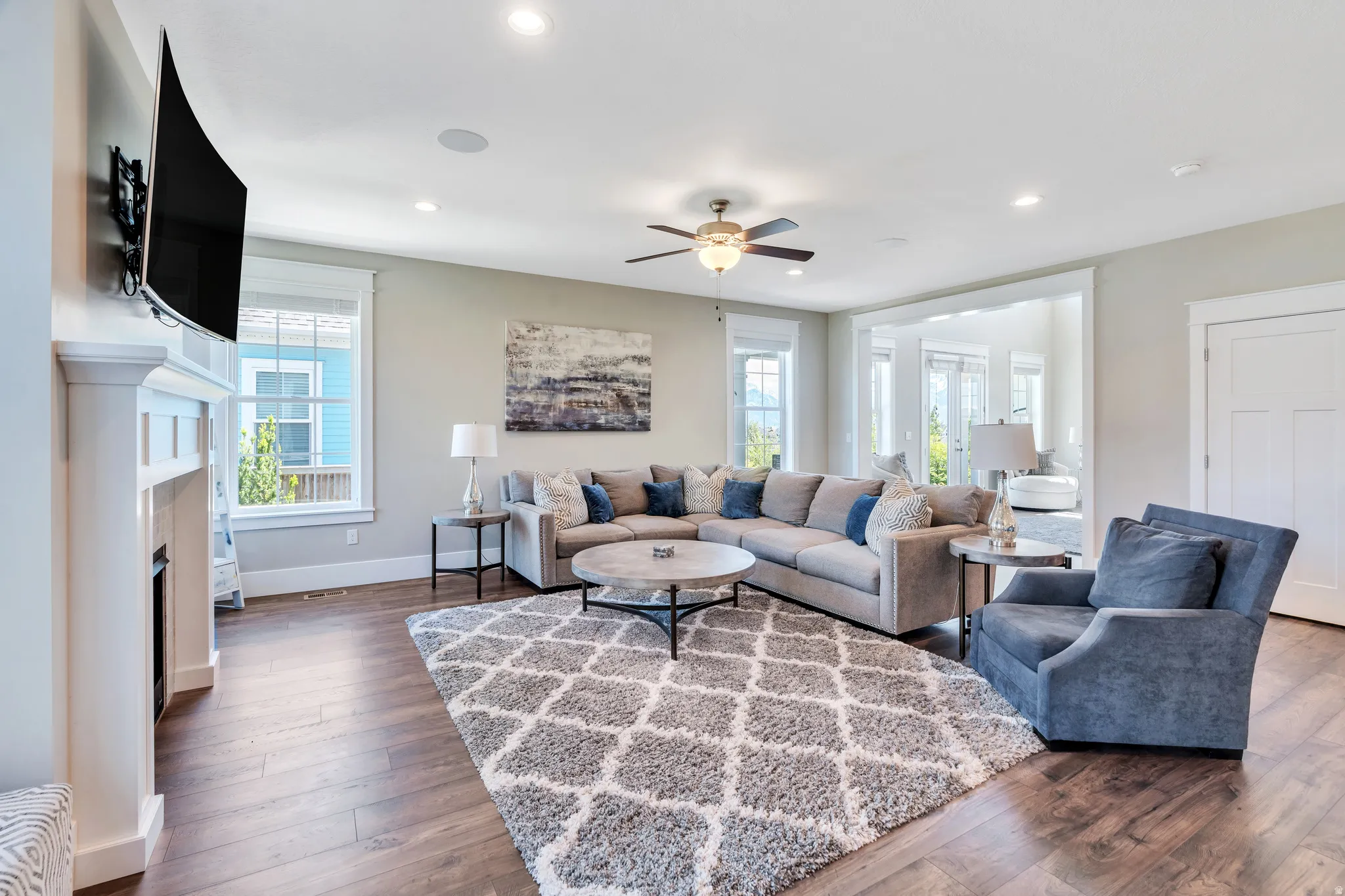 Light flooded living room featuring rich wood flooring, and ample natural light
