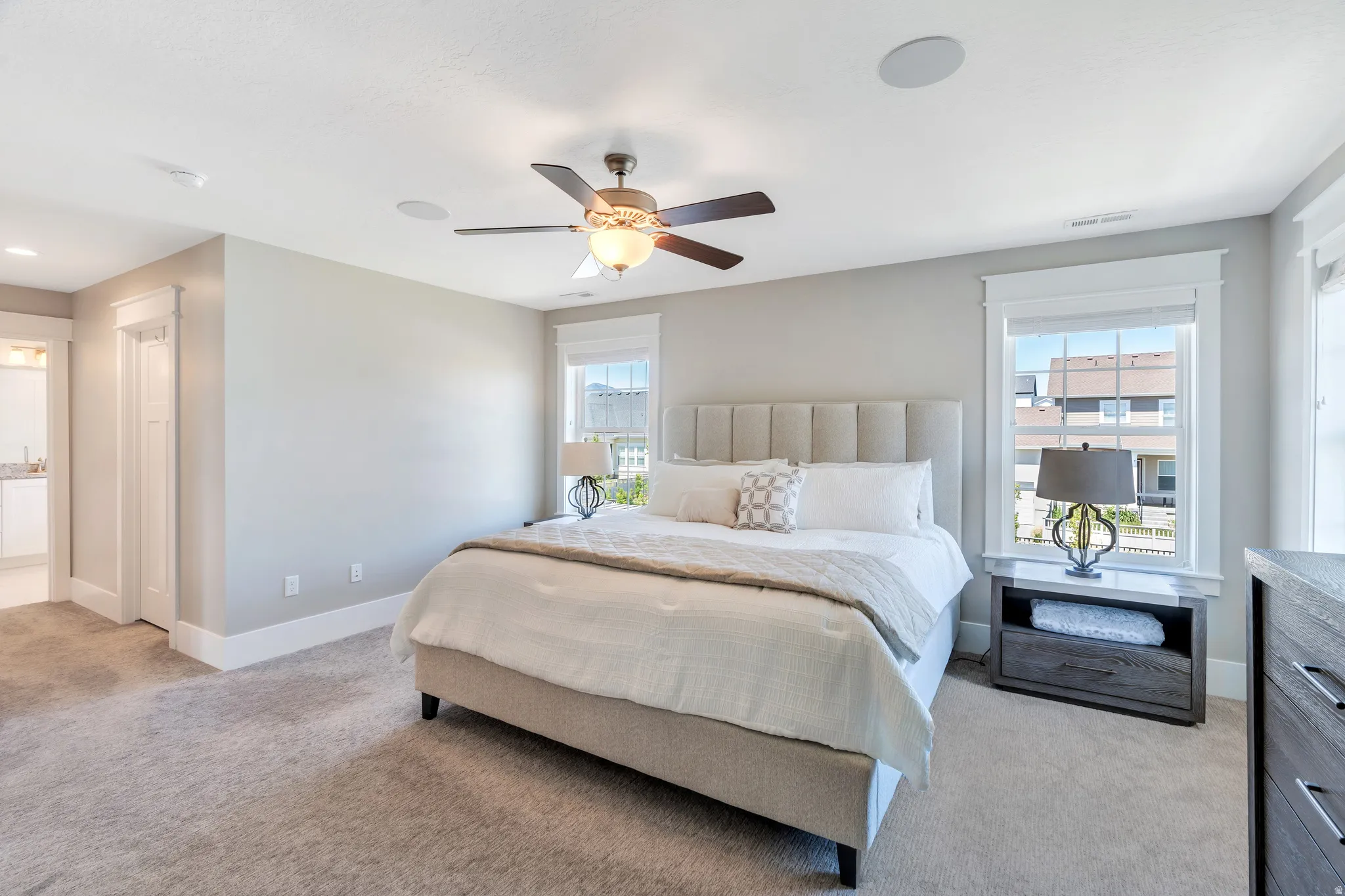 Featuring abundant natural light, and attached ensuite access, and 1 of 2 closets