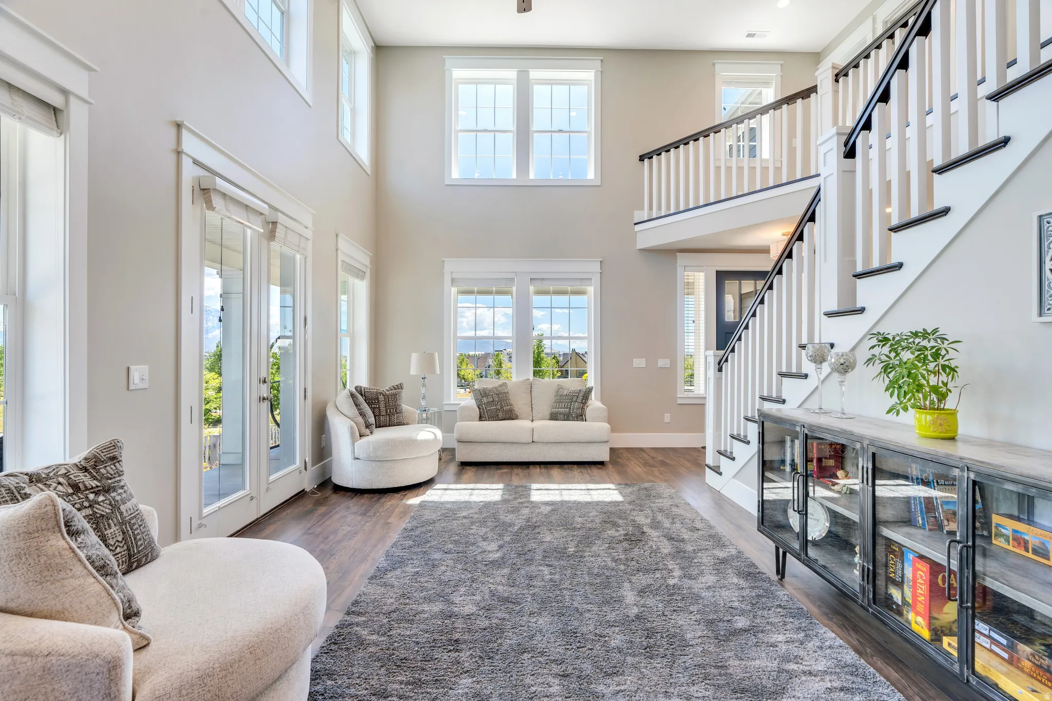 Light flooded room, featuring access to the wrap around porch, high raised ceilings and windows