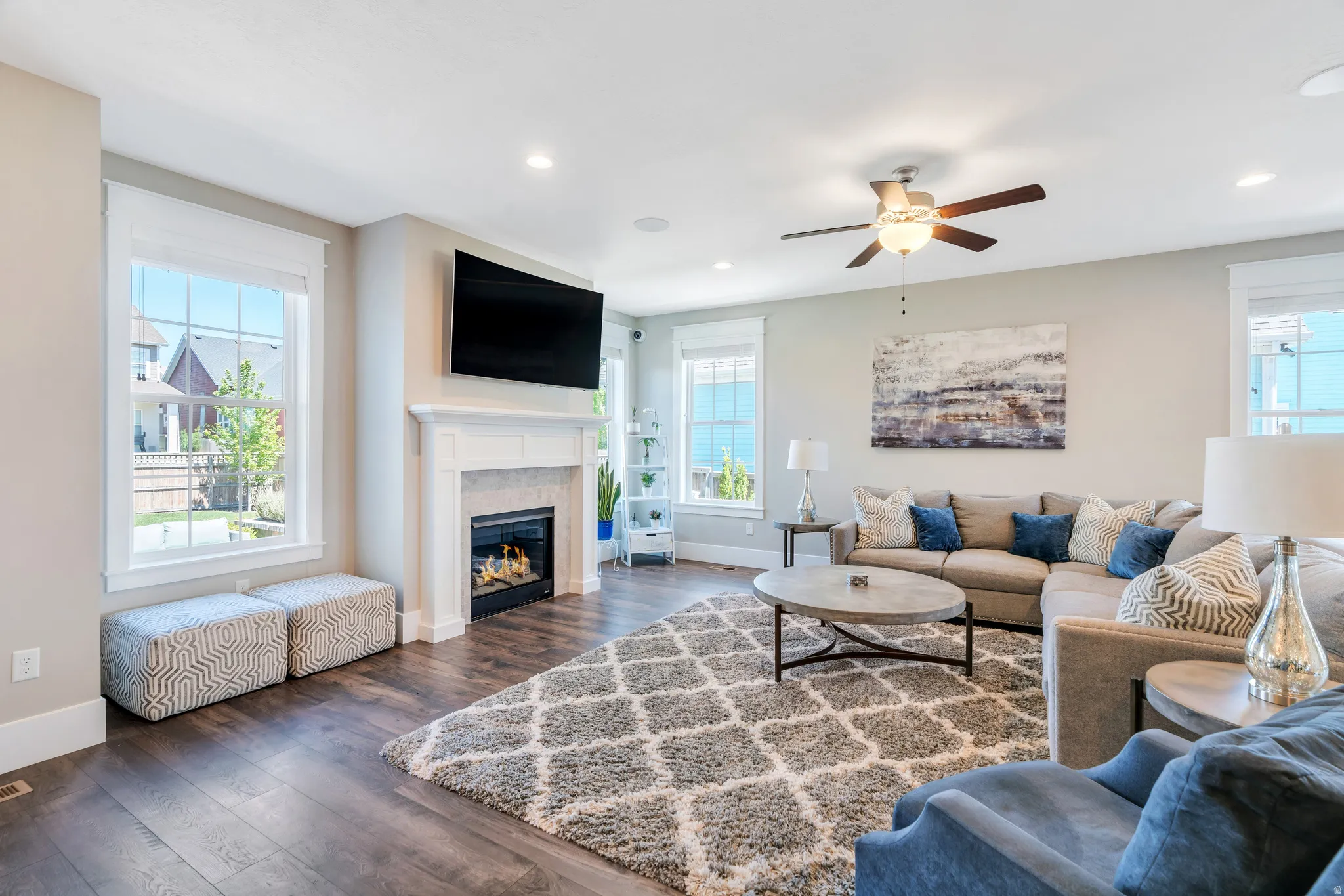 Bright living room featuring fireplace, and ample natural light to shine through