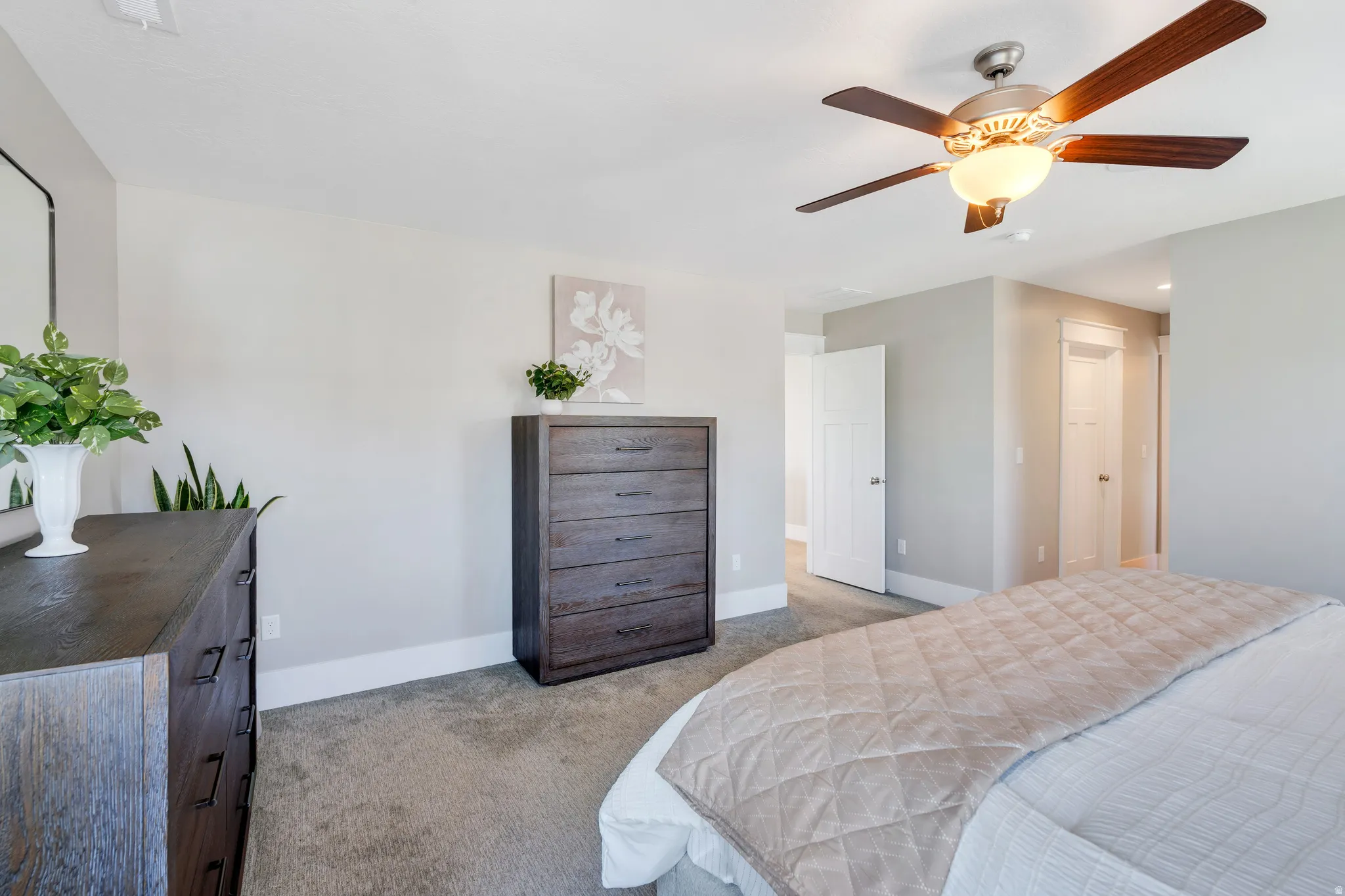 Showcasing the primary suite's additional space, corridor, and the second closet