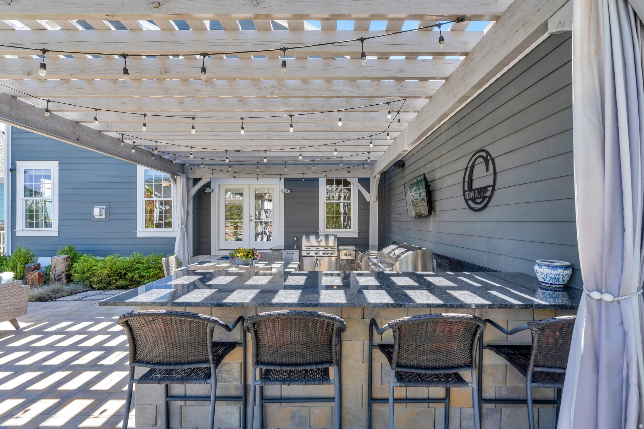 Featuring the outdoor dry bar seating