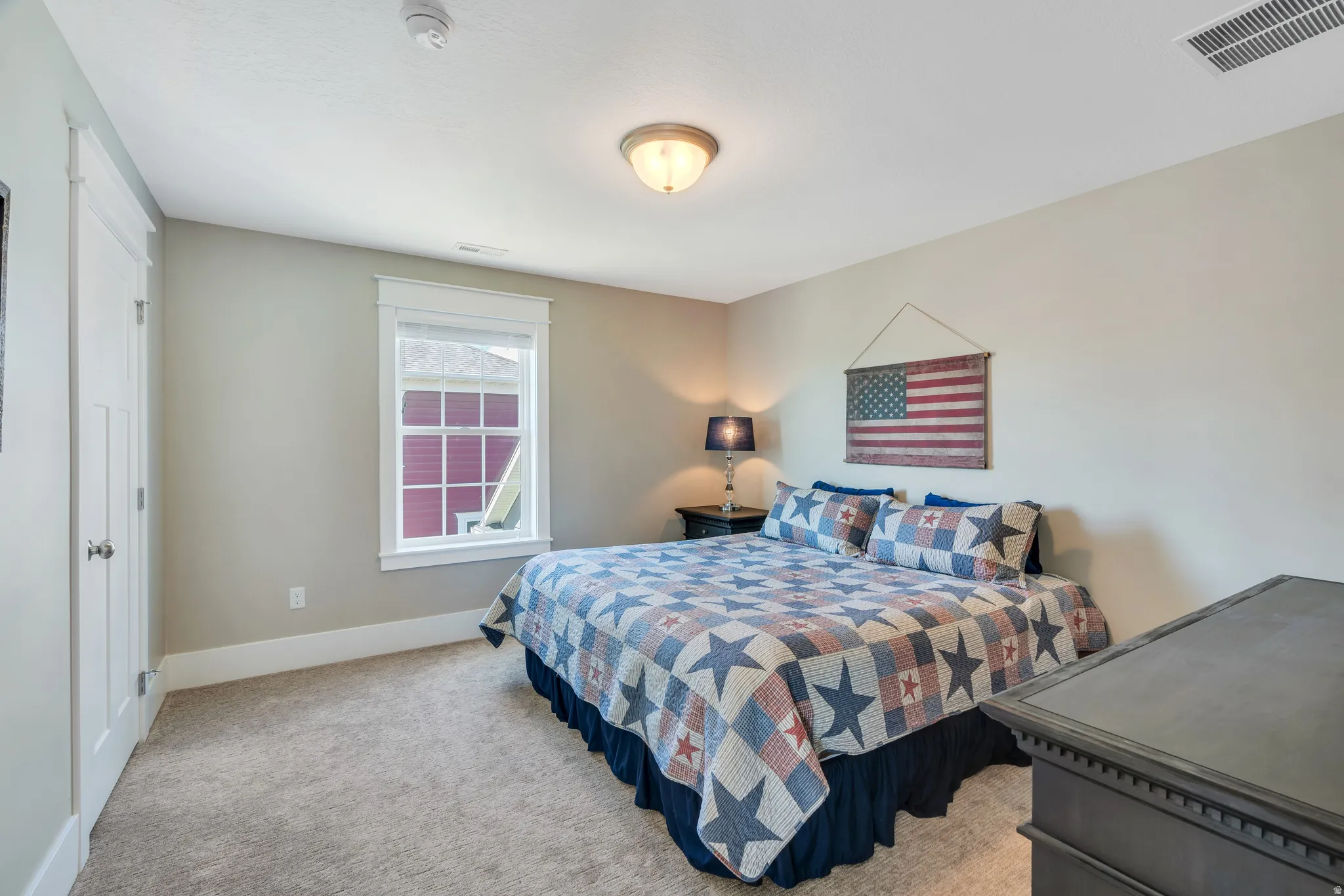Spacious upper level bedroom featuring spacious closet