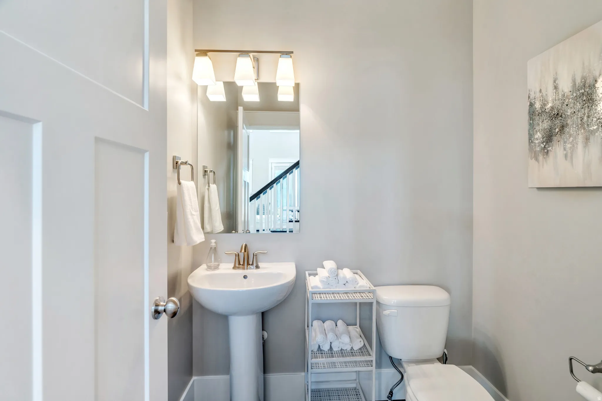 Featuring the main floor pristine half bath