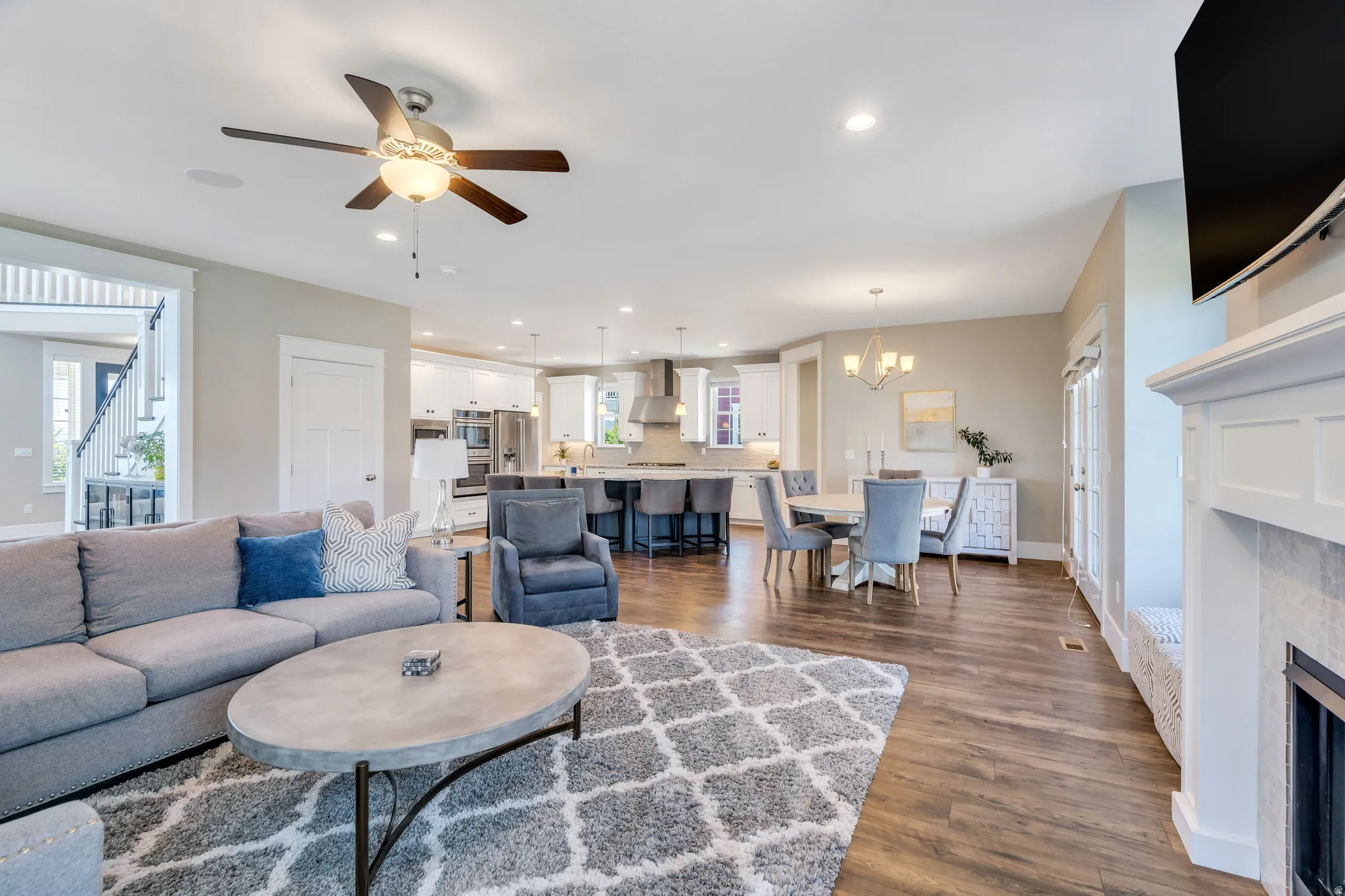 Features living room space, and access to the kitchen and dining areas