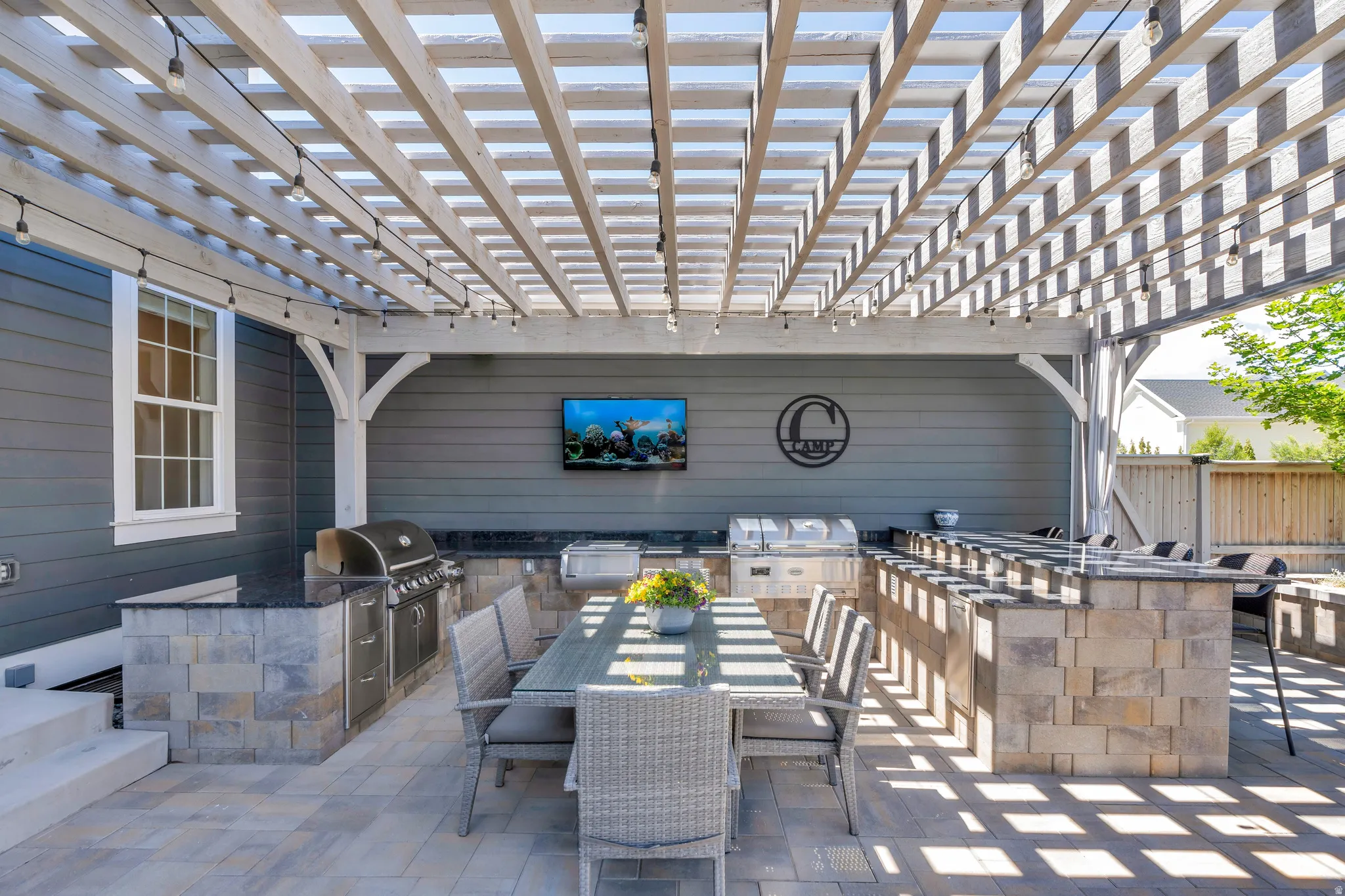 Elegant pergola picnic seating, and grilling area with dry bar seating