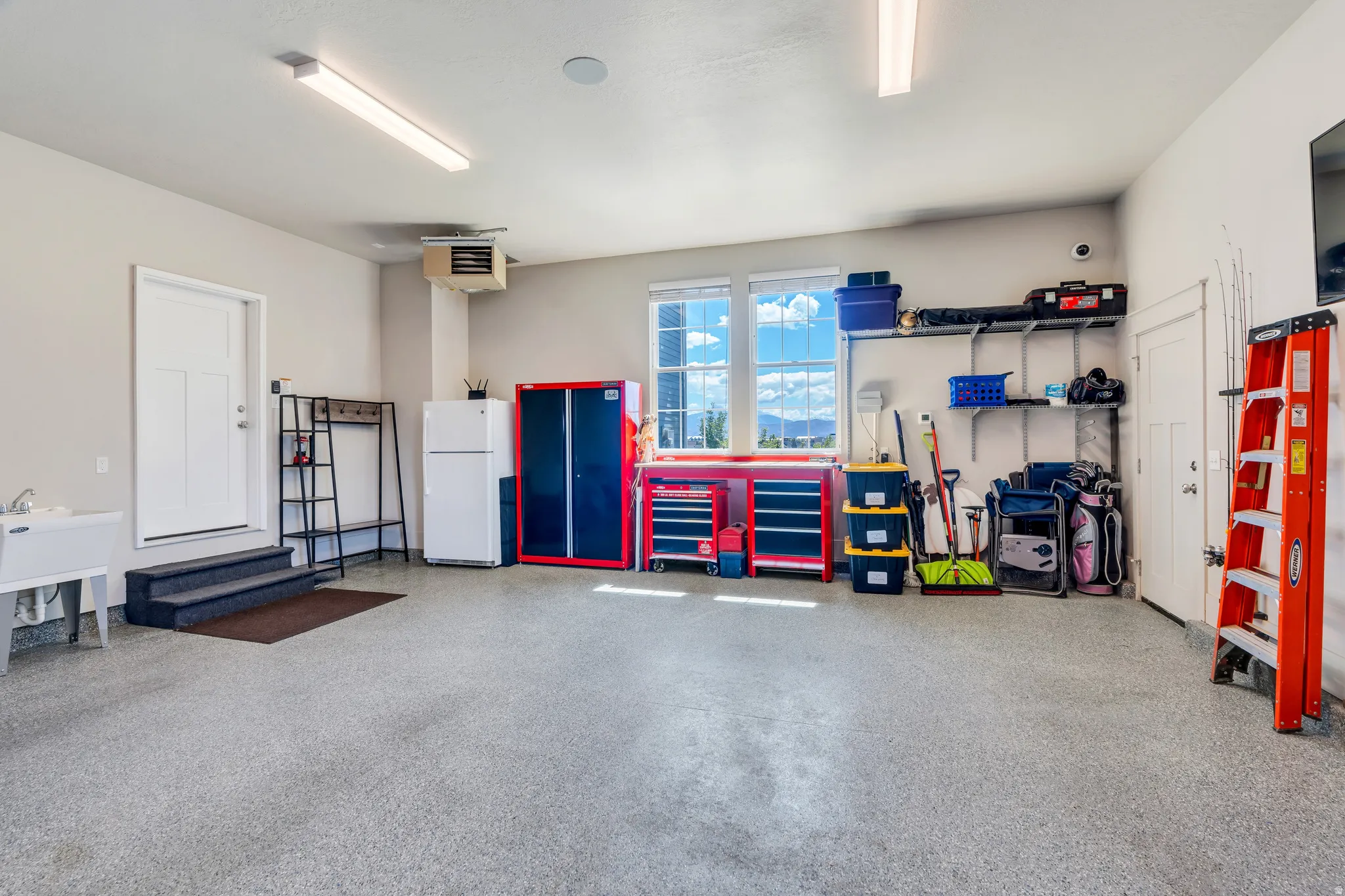 Heated garage with sink and workshop space!