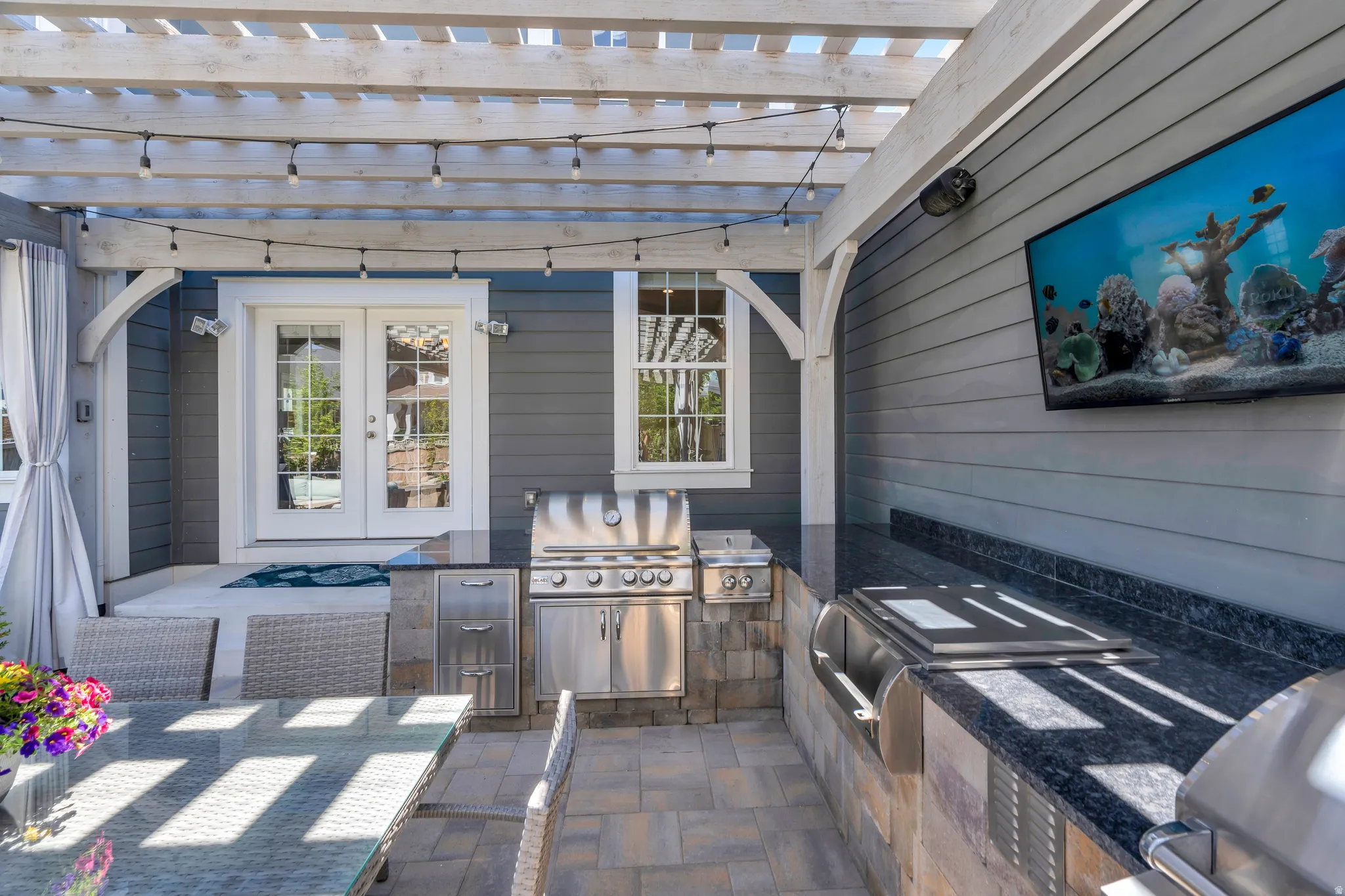 Enjoy access to this grill master station with grill, and stovetop integrated in the granite countertops