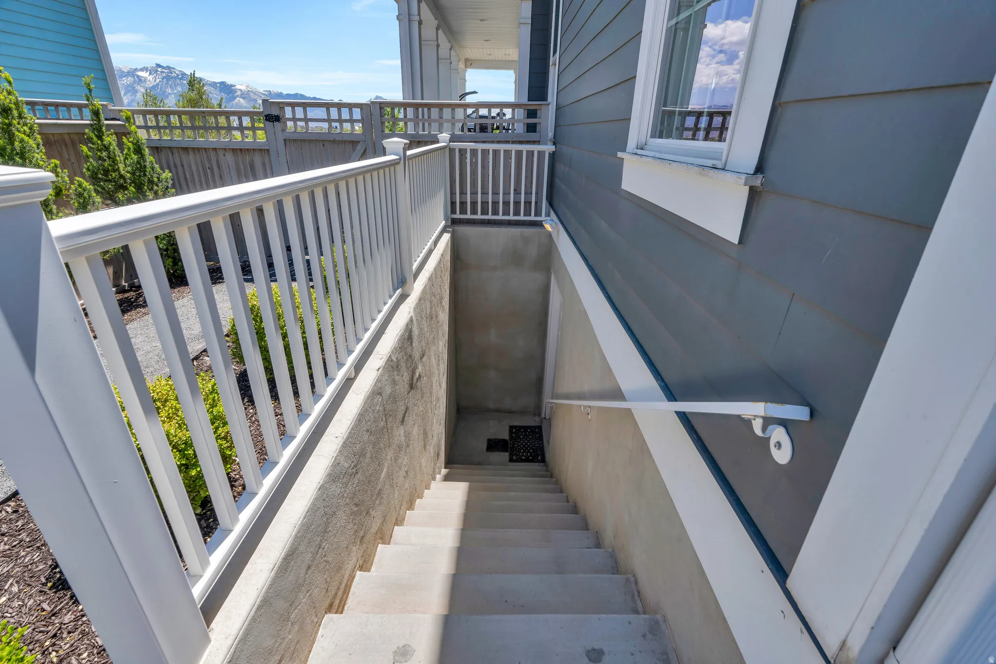 Showcasing the private basement entrance and gated backyard entrance