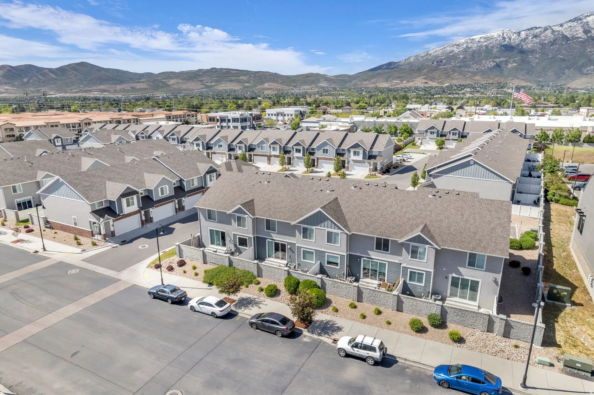 Modern townhome community featuring multi-story units with private balconies and patios