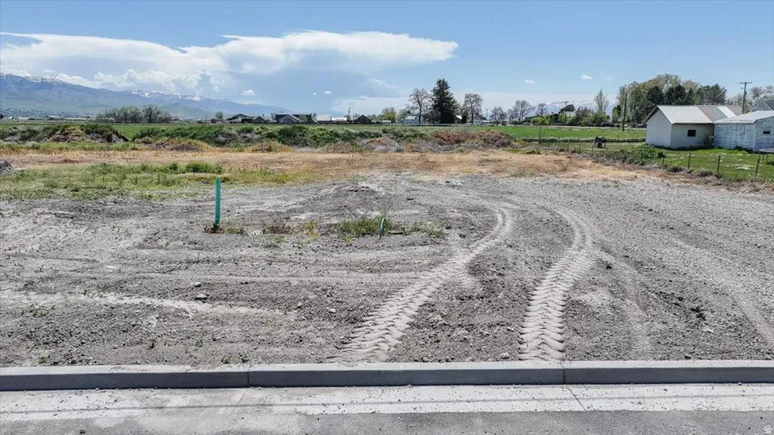 Expansive undeveloped lot with mountains in the background