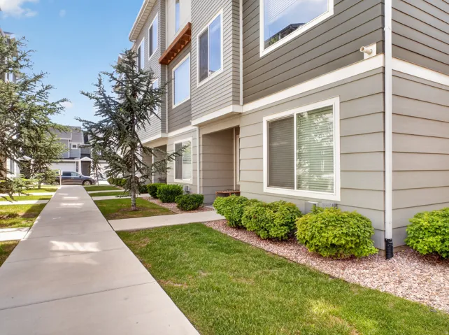 Modern townhome exterior featuring multi-toned horizontal siding